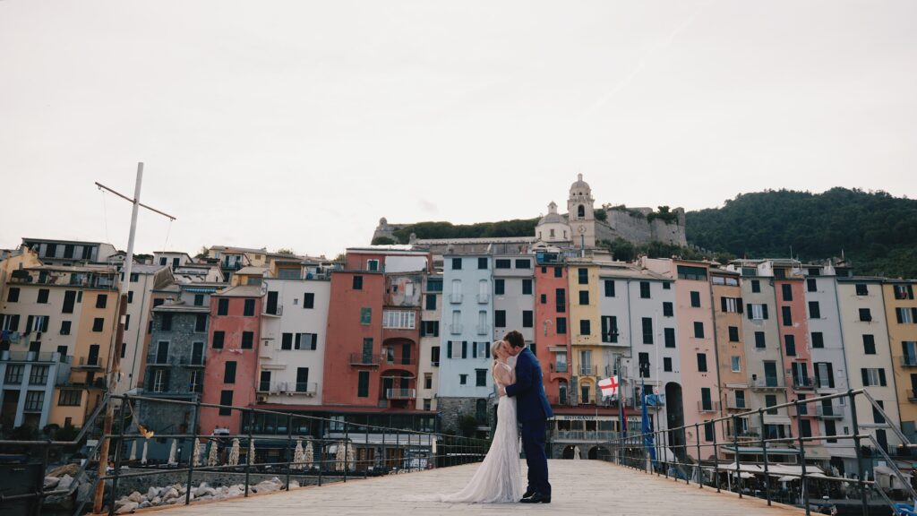 Couple walking through colorful streets of Cinque Terre village